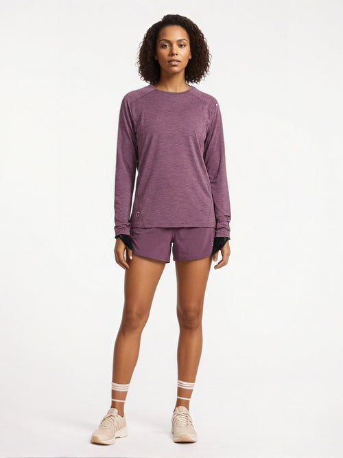 Performance long sleeve top lifestyle image 02: black purple standing