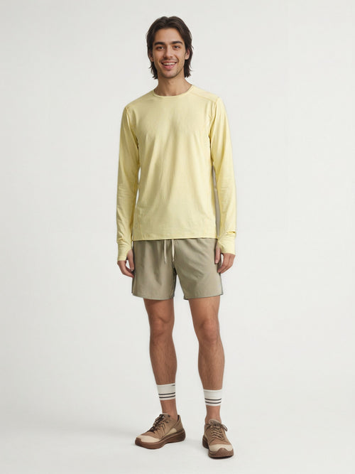Performance long sleeve top lifestyle image 03: white yellow standing