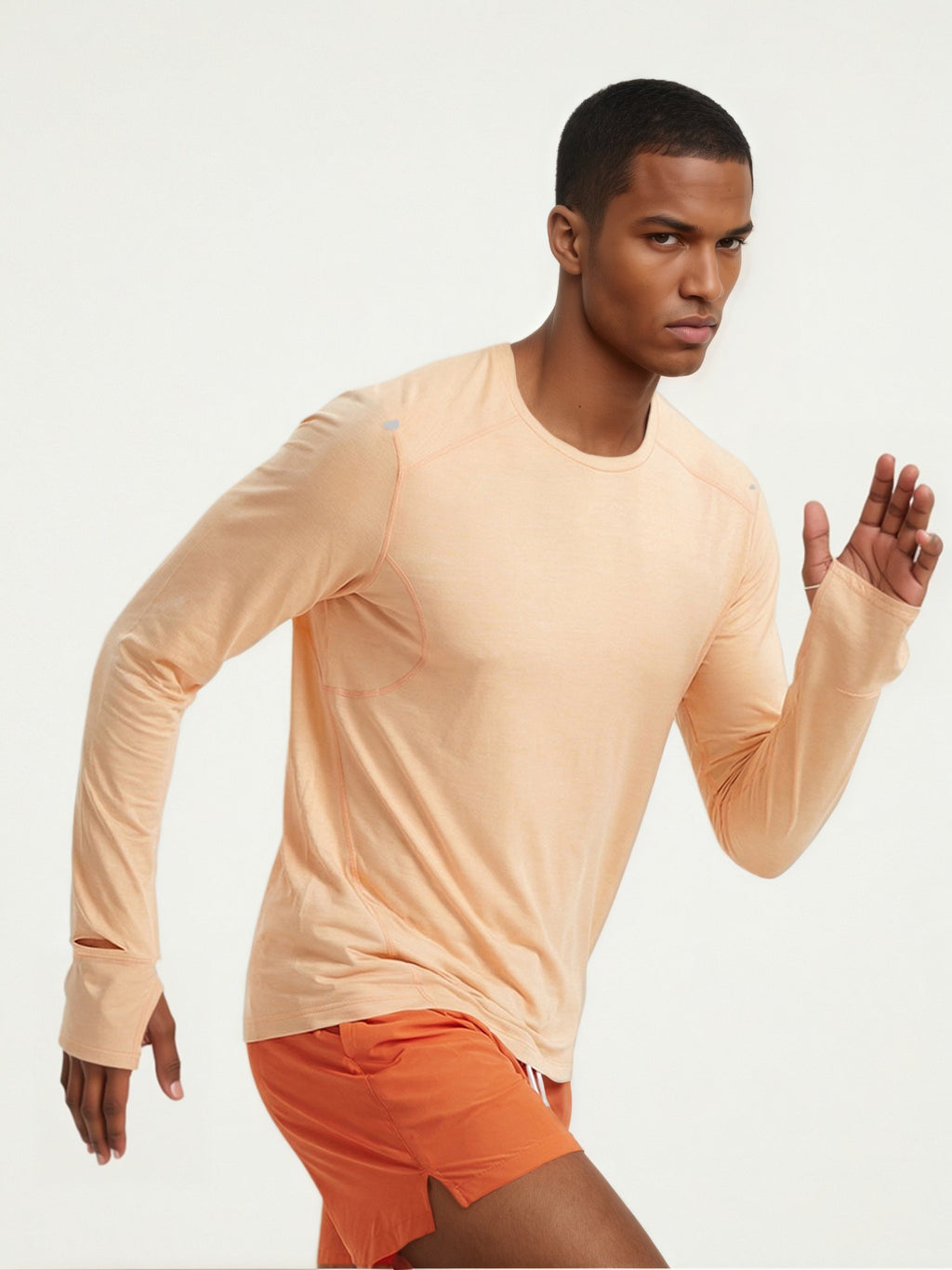 Performance long sleeve top lifestyle image 04: black orange running