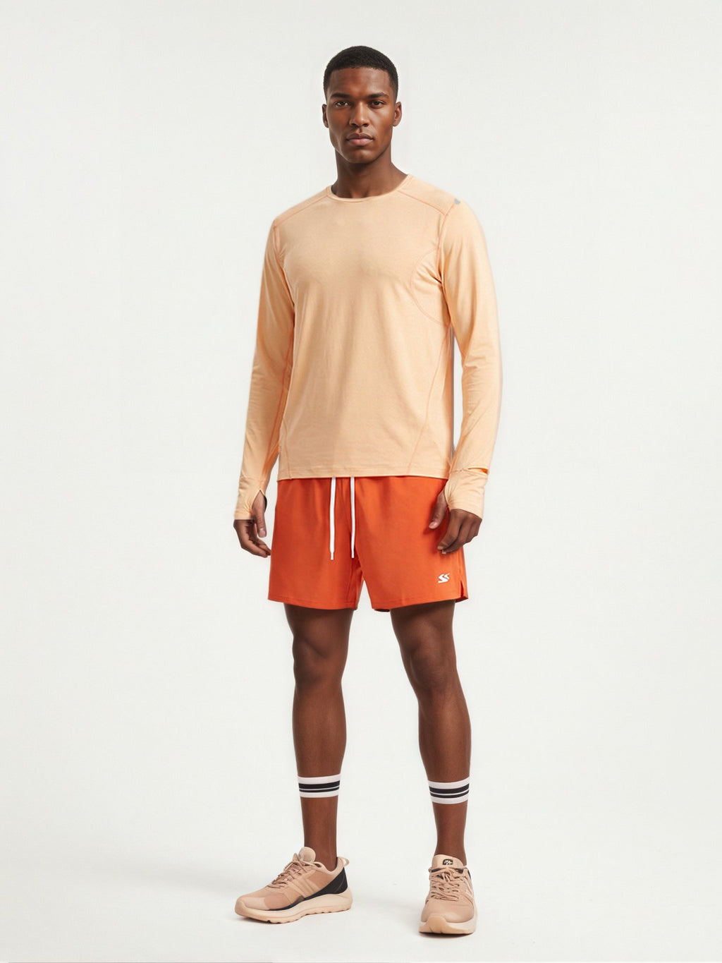 Performance long sleeve top lifestyle image 10: black orange standing