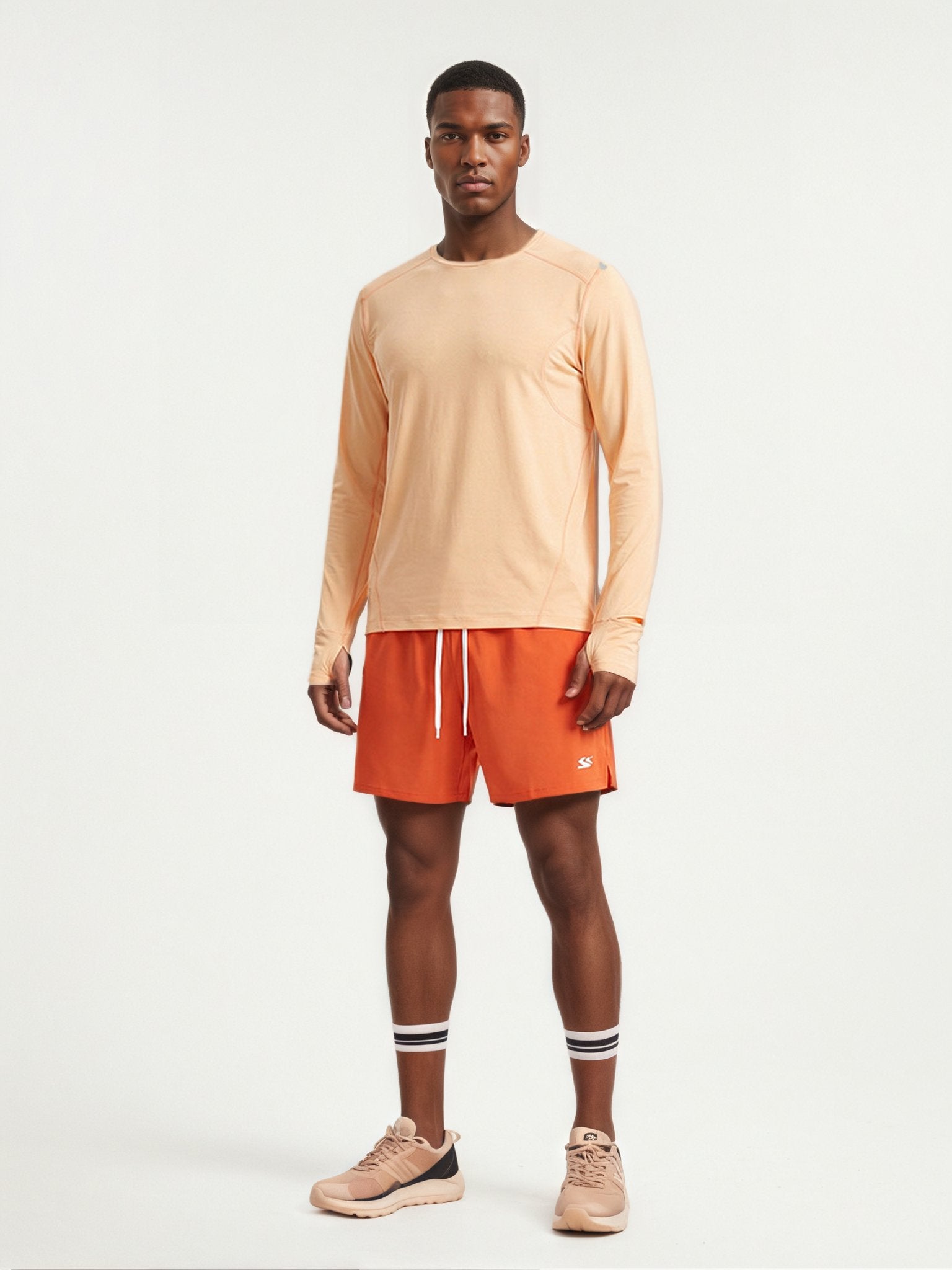Performance long sleeve top lifestyle image 10: black orange standing